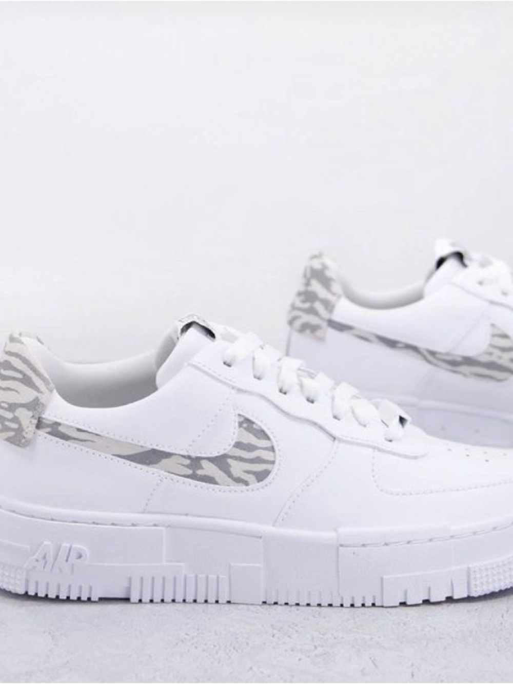 Nike Air Force 1 Pixel trainers in white and zebra print